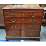 A George III mahogany chest of four long graduated drawers with ivory escutcheons,