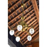 A gilt hanging five branch electrolier with cut glass globe shades,