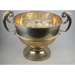 A large and heavy silver rose bowl with twin scroll handles, on stemmed foot,