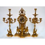 A late 19th century French gilt mantel clock garniture,