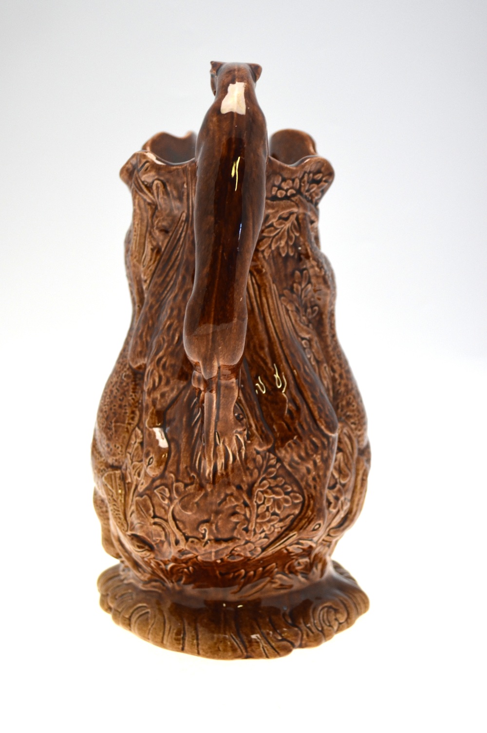 A 19th century brown glazed jug moulded with game - rabbits, ducks, fox, etc. - Image 3 of 5