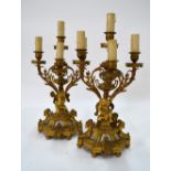 A good pair of 19th century French ormolu five-branch candelabra mounted with porcelain panels and