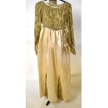 A 1920s pale lemon silk velvet coat with ivory silk lining fastened with a single button,