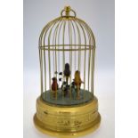 A clockwork automaton bird cage with three chirping birds within with moving heads,