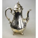 An early Victorian silver pear-shaped coffee pot, the domed cover with melon finials,