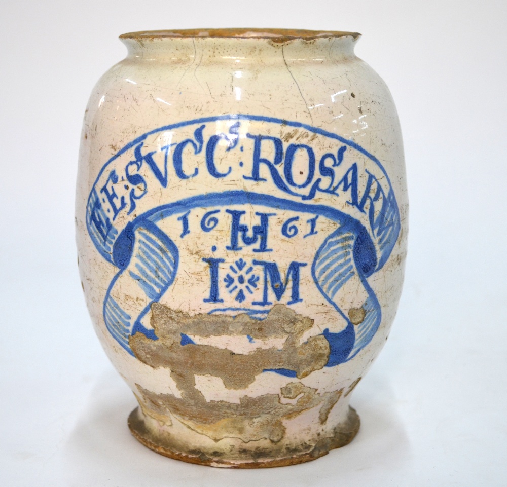 A 17th century Italian majolica drug jar inscribed and decorated in underglaze blue 'E :E;