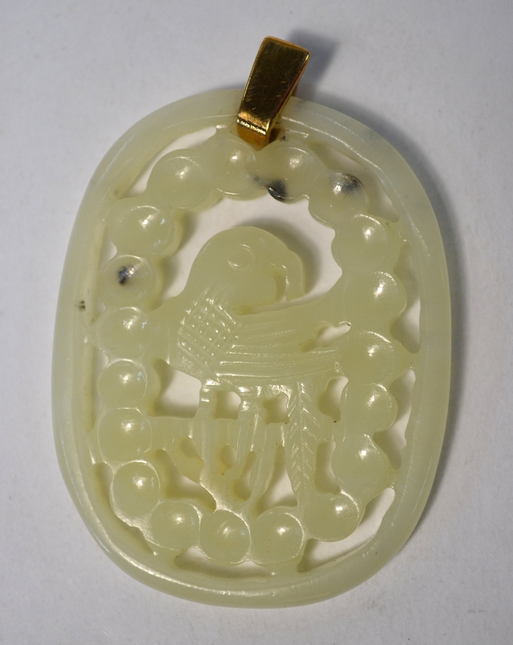 Two green jade pendants of reticulated form: one decorated with a flower arrangement; - Image 4 of 5