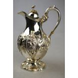 A Victorian silver pear-shaped chocolate pot, the hinged cover with floral finials,