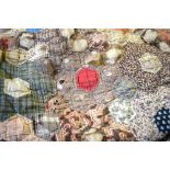 A Victorian patchwork quilt worked in hexagonal patches in multi-patterned cottons,