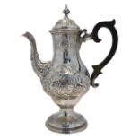 A George III silver baluster coffee pot, richly embossed and chased with sprays of flowers,