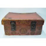 A Chinese red leather chest and cover of rectangular form,