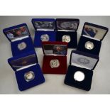 Seven boxed commemorative silver proof five pounds