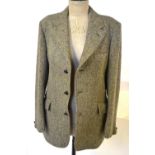 A gentleman's Harris Tweed herringbone jacket, moss green/browns with leather 'football' buttons,