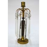 A Regency parcel gilt bronze candlestick with cut glass lustre drops,