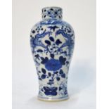 A small blue and white vase, decorated with four-clawed dragons,