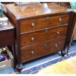 A 19th century mahogany commode having three long drawers flanked by fluted full-height pilasters,