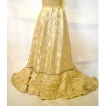 A Victorian ivory silk floral damascene brocade skirt with short train,