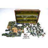 A large collection of unboxed and played-with Dinky, Corgi and other military vehicles,