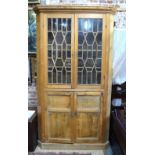 A George III stripped pine corner cabinet,