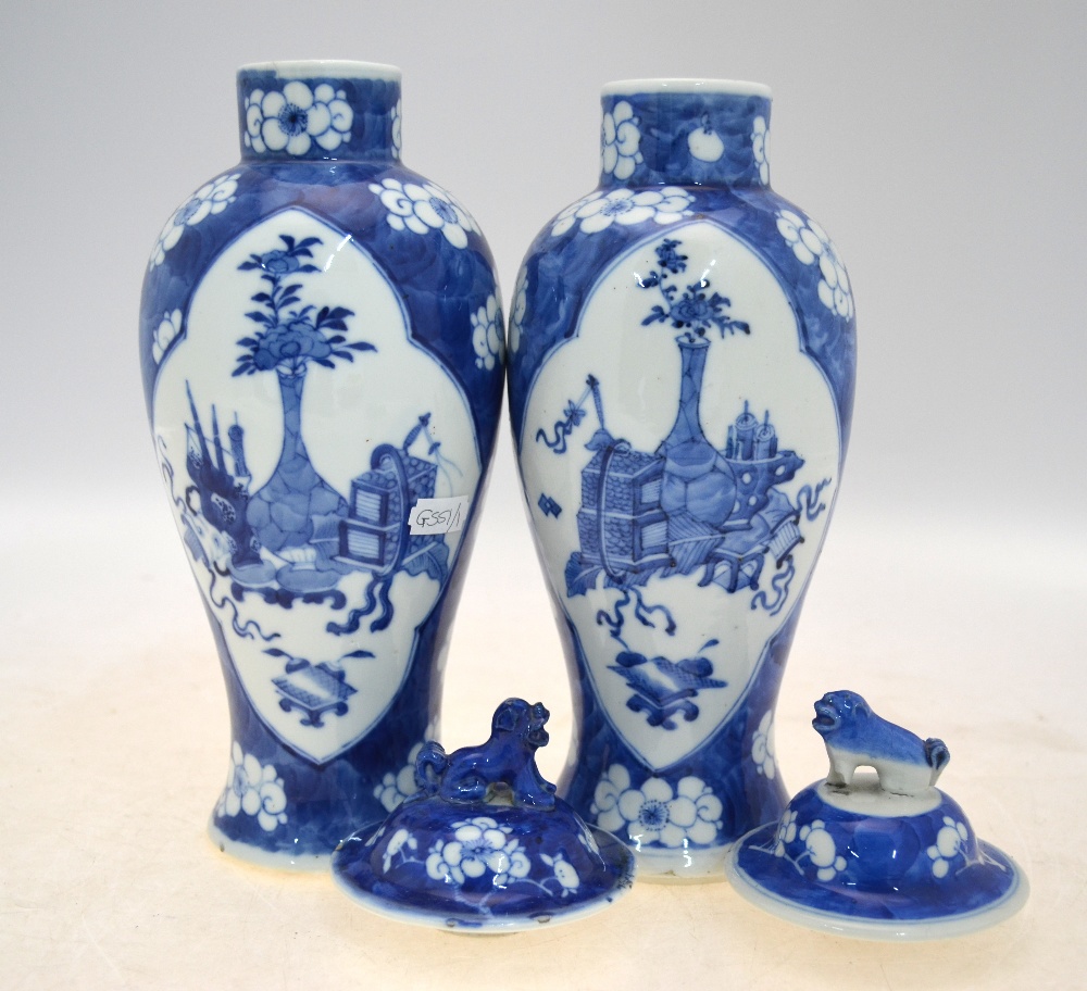 A pair of blue and white vases and covers; 26 cm high; each base with a Kangxi four-character mark, - Image 2 of 8