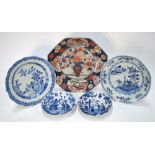 A small pair of blue and white dishes, each decorated with four figures, 15 cm diameter,