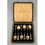 A cased set of six Norwegian Art Nouveau silver gilt and enamel coffee spoons with floral-decorated