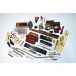 A quantity of vintage collectables including a pair of bone-handled boot-pulls, bone toothbrushes,