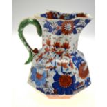 A mid 19th century Masons Ironstone Imari decorated octagonal water jug with serpent formed handle,