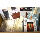 Approximately thirty pairs of 1960s-80s stockings in original packaging, two evening bags,