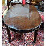 A late 19th century/early 20th century mahogany extending dining table,