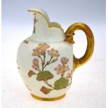 A Royal Worcester ivory ground jug with gilt loop handle, decorated with floral sprays; 15 cm high,