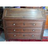 An 18th/19th century French oak bureau, the hinged slope enclosing drawers,