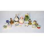 Four Royal Doulton figures of girls; a Hummel figure of a boy; eight small pill boxes;