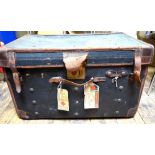 A canvas leather bound cabin trunk with labels for Cunard Line Condition Report