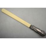 A late Victorian ivory page-turner with embossed silver handle, Henry Matthews,