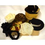 A collection of vintage ladies' hats to include; a cream mink hat, a mid brown mink hat,