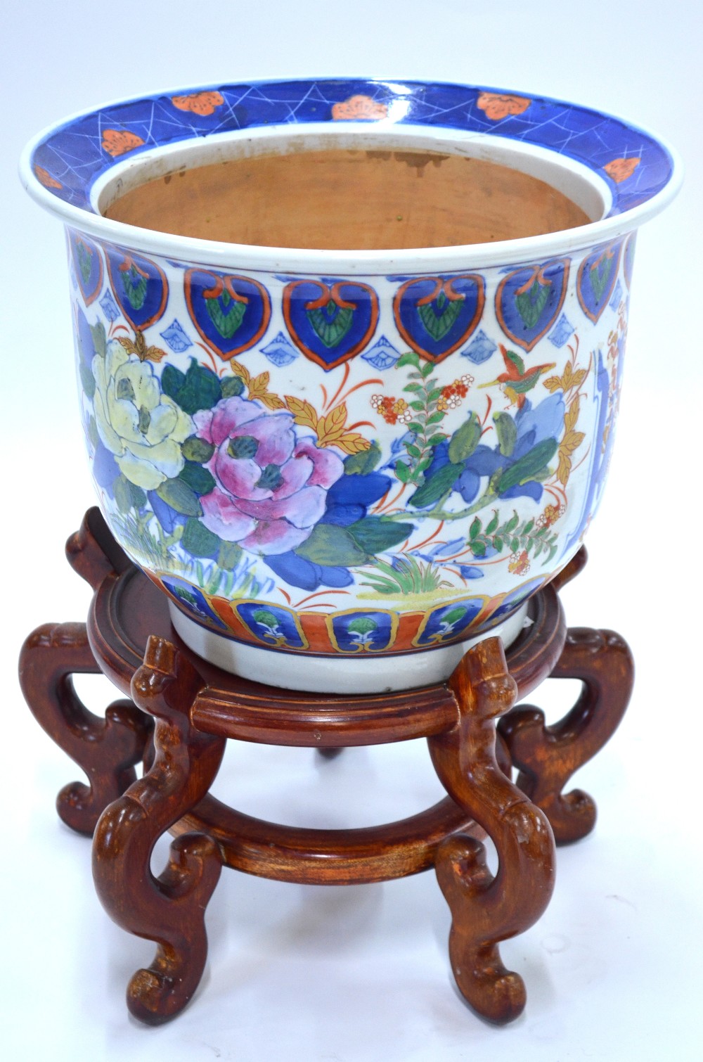 A famille rose and underglaze blue decorated planter; the base with six-character mark;