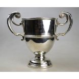 An Edwardian heavy quality silver trophy cup with twin scroll handles and stemmed foot,