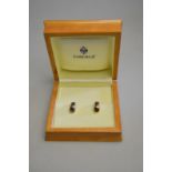 Modern Fabergé - A pair of sapphire and diamond earrings for pierced ears,