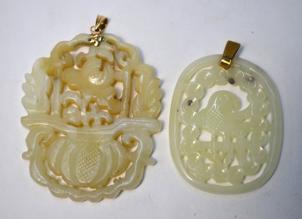 Two green jade pendants of reticulated form: one decorated with a flower arrangement; - Image 2 of 5