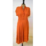 A 1940s burnt orange heavy crepe dress, 50 cm across chest,