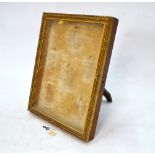 An Edwardian gilt gesso glazed miniatures case with rear strut stand,