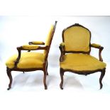 A pair of late 19th century French hardwood framed open arm fauteuils with serpentine form