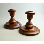 A pair of 19th century turned fruitwood (probably pear) chamber sticks 11 cm h