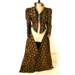 A Victorian black silk open over-dress with boned bodice to jacket,