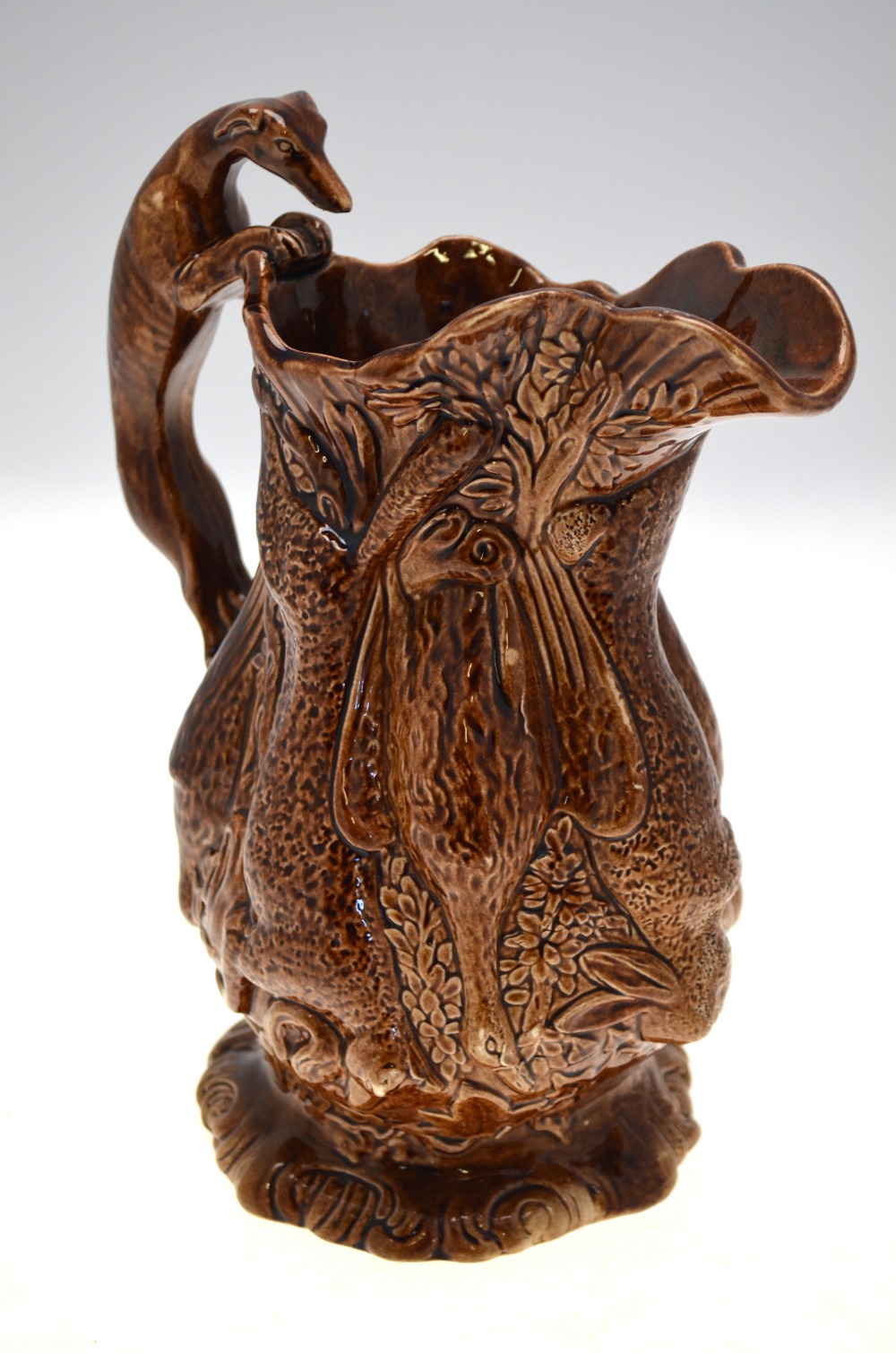 A 19th century brown glazed jug moulded with game - rabbits, ducks, fox, etc. - Image 5 of 5