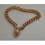 A 9ct rose gold curb bracelet and padlock,