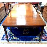 A 19th century mahogany sectional dining table composing a pair of end tables with rounded corner
