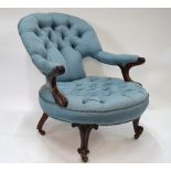 A Victorian mahogany framed button upholstered easy open armchair with scroll arm detail,