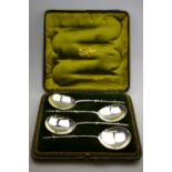 A Victorian cased set of four silver serving spoons with circular bowls and turned handles, Holland,
